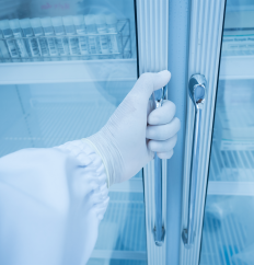scientist opening a supplies cabinet